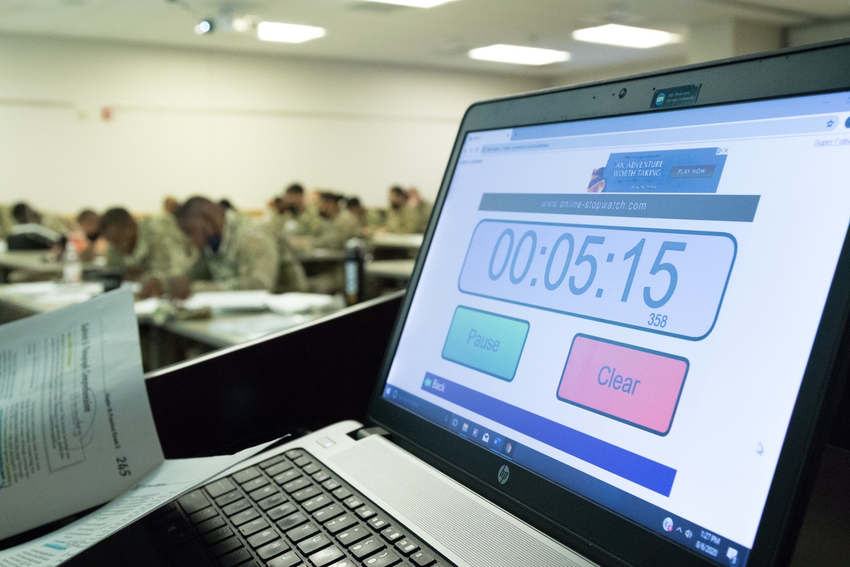 Connecticut Army National Guard recruits work with a counselor during an ASVAB improvement class